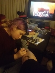 Her purple look while practicing "tattoos" on my legs